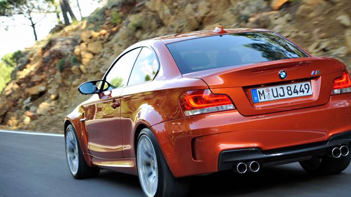 Running Back Pose Of BMW 1 Series M in Orange